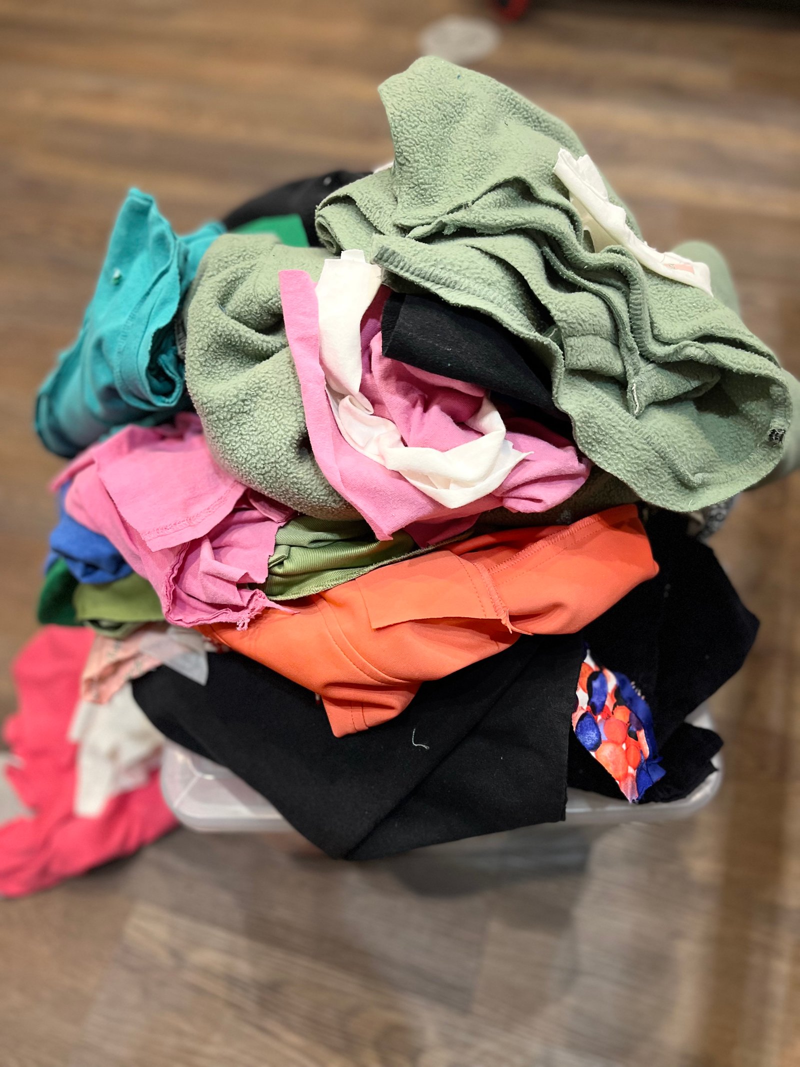 Keepsakes — blue and orange clothing gathered for a memorial quilt